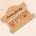 Detail of bohemian braided bracelets with natural red stones and clear beads set - Rose Red