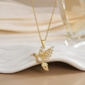 Close-up of gold-plated hummingbird pendant with micro-pave white cubic zirconia - FN0118 Full Pave White Zircon Hummingbird