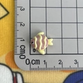 Close-up of pink and yellow striped resin fish charm measuring 1.5 cm for crafts - Striped Fish