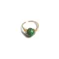 Close-up of handmade gold wire wrapped ring with a green spotted natural stone - One Size / Green