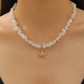 Boho layered necklace with golden starfish pendant and white pebble beads on model - KC Gold White (3245)