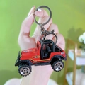 Mini red off-road vehicle toy keychain with gold graphics and black rugged tires - Game Console Keychain - Jeep Pullback Car - Red