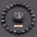 Detailed view of dark grey labradorite crystal beaded bracelet and polished stone - Larvikite
