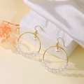 Elegant gold hoop earrings featuring ten white pearls displayed on a white stone background - Pearl Circle Earrings/Ear Hook