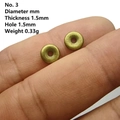 Macro shot of 1.5mm thickness bronze wheel spacers held on fingertips for jewelry making - No. 3 7mm Smooth Spacer (1.5mm Thick)