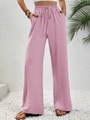 Detail of high waisted wide leg trousers with elastic drawstring and side pockets - Pink