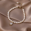 Detail of baroque freshwater pearl bracelet with gold hardware and zircon pendant - 9# Square Pendant Bracelet