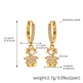Detailed view of gold plated stainless steel girl pendant earrings with white zircon - Q119-Huggie Girl Pendant Gold Earrings