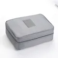 Grey textured travel toiletry bag with TRAVEL logo and single compartment without dividers - Grey Without Partition