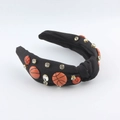 Detailed close-up of a black knotted headband with basketball ornaments and rhinestones - Black Basketball Style