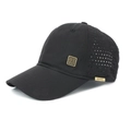 Detail of black breathable baseball cap showing laser-cut mesh and gold metal emblem - Adjustable / Black