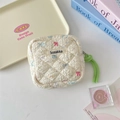 Detailed close-up of quilted sanitary pad storage bag with bow print and green knot zipper - Star Rabbit