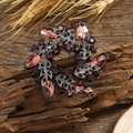 Vintage style red crystal flower brooch with rhinestone leaves on a rustic wood background - Purple Bauhinia Style (3.6cm)