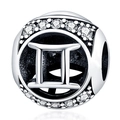 Macro view of silver Gemini zodiac charm with sparkling white crystals for DIY bracelets - Gemini