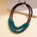 Detail view of double-layered wood and turquoise shell bead ethnic long necklace - Blue
