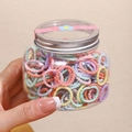 Bunte Makronen-Haargummis in einer transparenten Flasche mit silbernem Deckel - Macaron Spiralring 300 Stück (Dose 2cm)