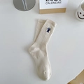 Beige rib-knit crew socks featuring a small navy blue cartoon rabbit embroidery detail - One Size / Solid Beige