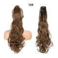 Brown claw clip-in ponytail extension with long wavy curls for a voluminous look - Flaxen