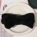 Macro detail of soft black coral fleece headband with a large bow for skincare - Bowknot Headband / Black