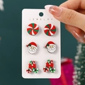 Three pairs of Christmas stud earrings featuring Santa, candy canes, and sweets set - Striped Candy Santa Claus Candy Cane Style (SD62510)