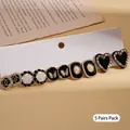 Vintage 5-pair earring set featuring black hearts and golden butterfly studs on card - Silver Needle-Black (10-Piece Set)