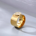 Modern wide gold ring for women featuring a circular pavé-set cubic zirconia centerpiece - US 7 / Gold