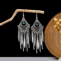 Detailed view of Bohemian tassel earrings with blue turquoise stone on rustic wood branch - E2870-8 Blue Rhombus Hollow