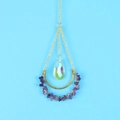 Detail of golden moon suncatcher with purple crystals and iridescent prism pendant - Purple Crystal