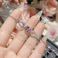 Macro shot of silver bracelet featuring a pink oval gemstone and pavé-set zircons - Pink Zirconia Oval Style (0023)