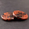 Polished mahogany obsidian stone discs with unique natural patterns and textures - Mahogany Obsidian