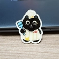 Cartoon black cat chef acrylic brooch featuring a white apron and blue spatula - Chef Black Cat