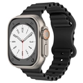 Close-up of a black silicone ocean band with wave design on an Apple Watch Ultra-style case - Black