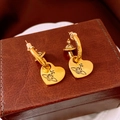 Golden heart drop earrings featuring an orbital planet logo on a brown leather surface - 34# Gold - Saturn Heart Dangle (Silver Earring Post)