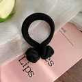 Elastic black hair tie with double-strand thick design and circular knot detail - Black