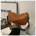 Detail of soft brown leather pillow bag with vintage blue pattern wide shoulder strap - Brown