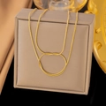 Golden snake chain necklace with flexible knot design on a premium jewelry box - Double Round Snake Chain Knot Necklace - Gold