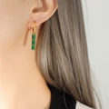 Minimalist gold plated drop earrings featuring three vertical rectangular green crystals - Gold