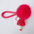 Close-up of red fluffy pom pom keychain with rhinestone mushroom charm and woven strap - Mushroom + Strap + Pompon / Red