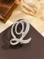Elegant silver L-shaped brooch with sparkling rhinestones in a cursive font design - Silver Letter Q