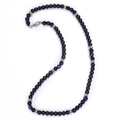 Close-up of black matte beads with blue cat eye stones and silver spacers on white background - Blue Tiger Eye + Matte Stone Necklace