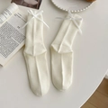 Off-white cotton mid-calf socks featuring ribbon bows and a classic ribbed texture - Ribbon Bow Style (ky) / Creamy White