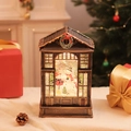 Close-up of vintage bronze Christmas musical lantern with warm LED glowing snow scene - Snowman / Bronze