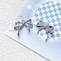 Detail view of a 22mm x 20mm silver alloy bow charm for DIY jewelry making - 26# Silver Bowknot Pendant