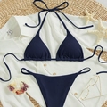 Dark blue ribbed halter bikini set on a beach straw mat with summer vacation accessories - Navy Blue