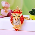 Sparkling owl keychain with red enamel and clear crystals on golden metal base - A430 Owl F Red