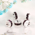 Macro shot of silver metal wheel beads with purple rhinestones for DIY jewelry making - Silver Plated Dark Purple