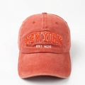 Detailed embroidery of New York Est 1625 text on a washed cotton brick red baseball cap - Orange