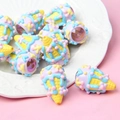 Macro detail of colorful ice cream cone resin beads for DIY jewelry and phone chains - 1 Piece / Pointed Bottom + Yellow Cone + Blue Purple Cream