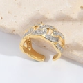 Macro detail of gold-plated Cuban link ring with pavé-set white zircon and open band - Gold Cuban Link Chain Braided Style