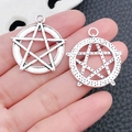 Pair of silver tarot star charms shown on hand for scale on grey background - Antique Silver-8331-28x31mm